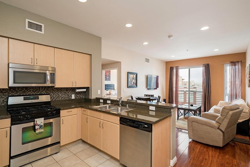 Enjoy a stainless steel and granite kitchen open t