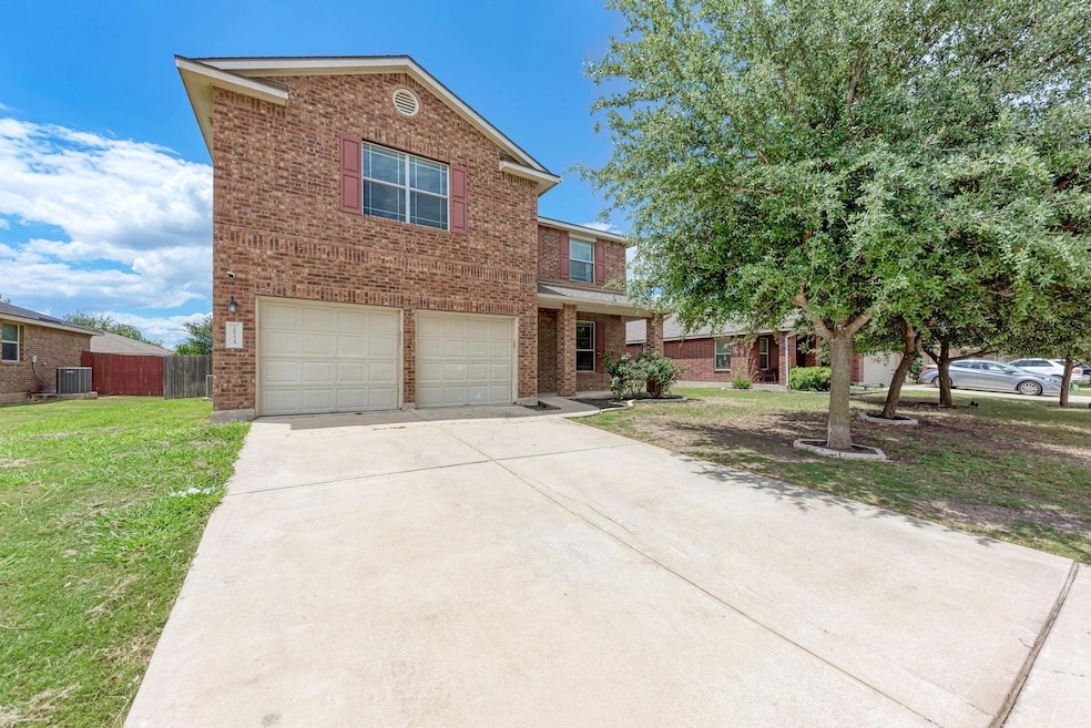 Traditional-style house featuring brick siding, a