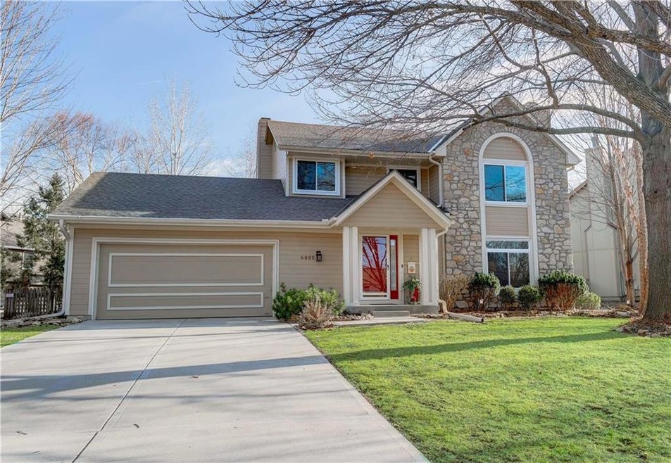 2 Story Home on tree lined street.