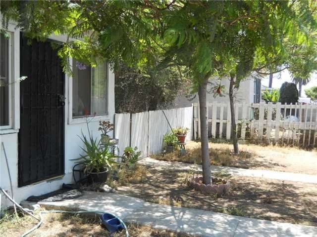 THE FRONT YARD OF THE DUPLEX
