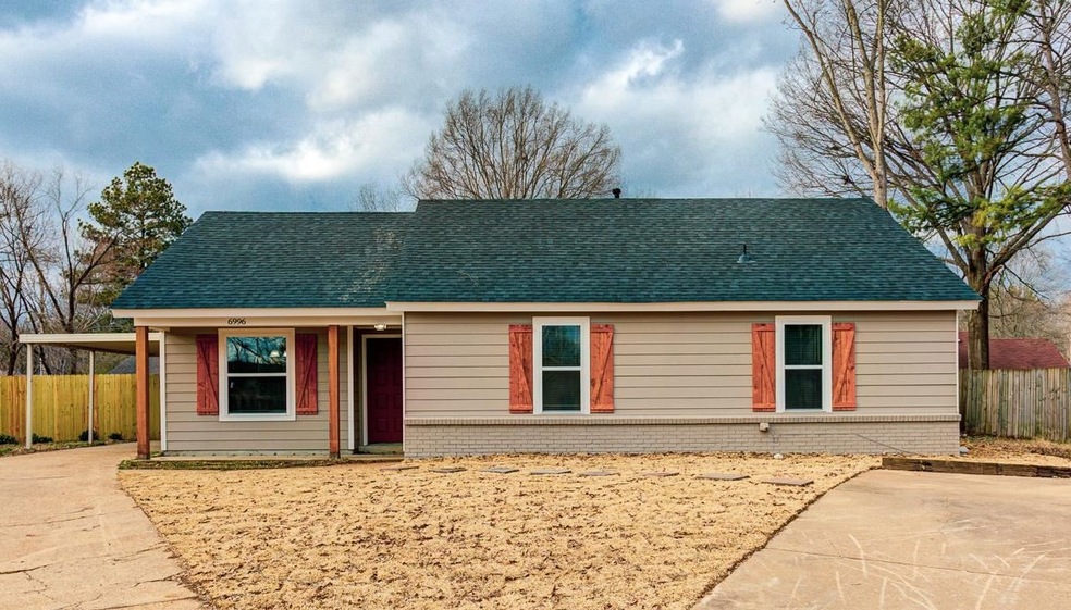 Ranch-style home featuring roof with shingles, fen