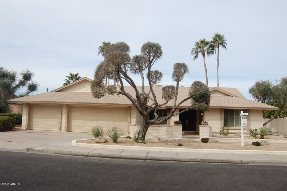 Front view with three car garage
