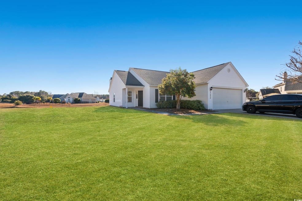View of front of property featuring a garage and a