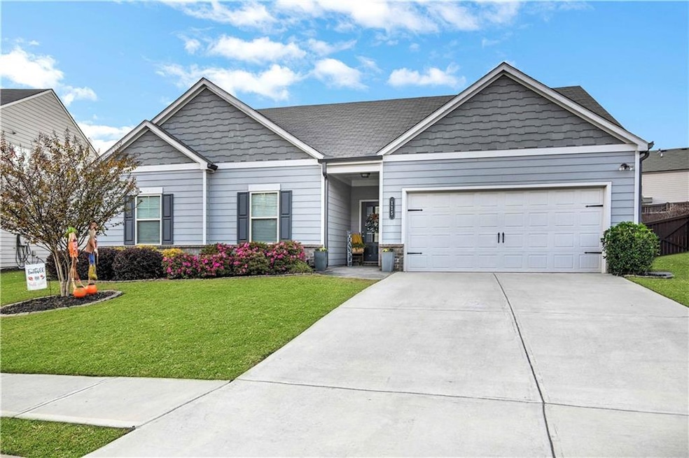 View of front of property featuring driveway and a garage