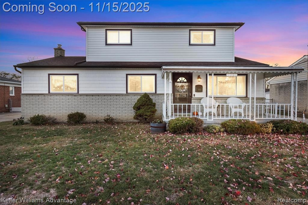 Traditional-style home with brick siding, a front lawn, a chimney, covered porch, and a shingled roof