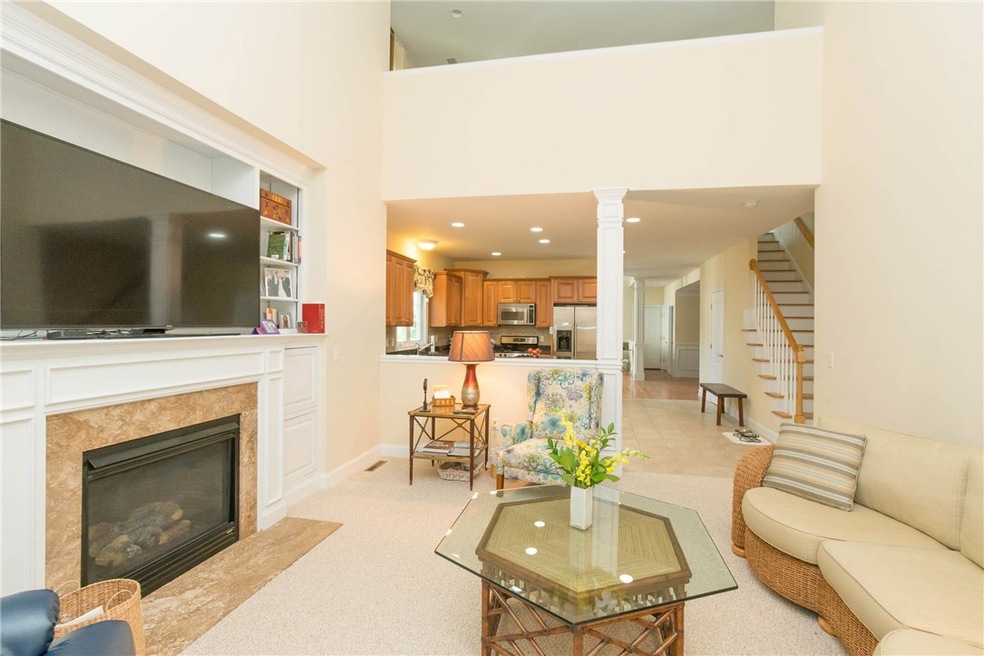 Marble Fireplaced Living Room with view to Kitchen