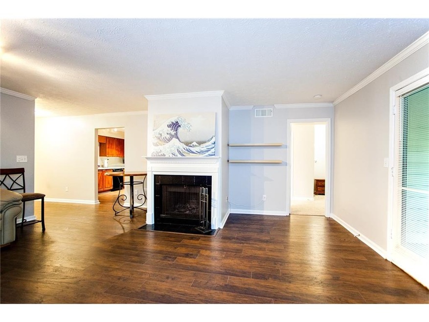 Great Room with gas fireplace and new wood floorin