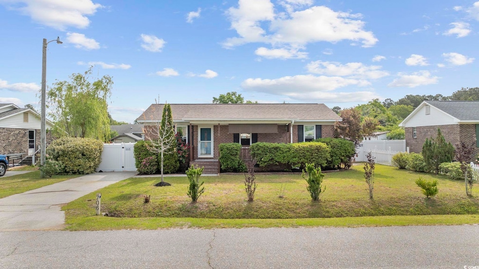 View of front of property featuring concrete drive