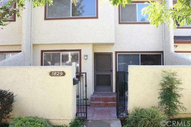 Front view of unit with cozy outdoor patio area