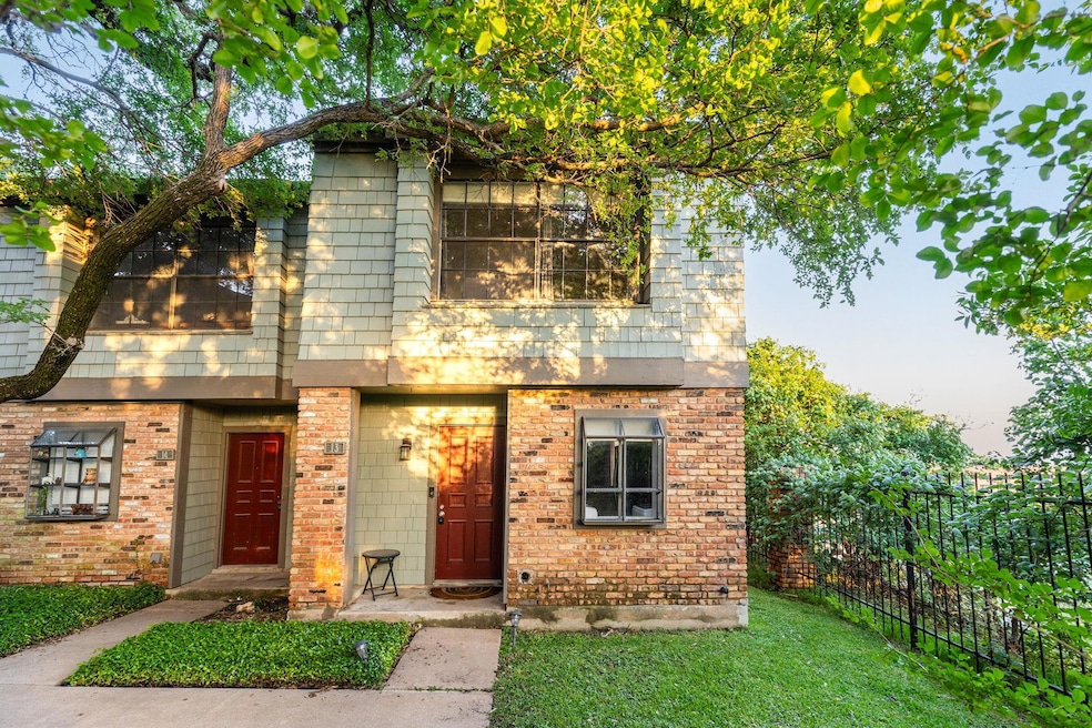View of front of home featuring brick siding