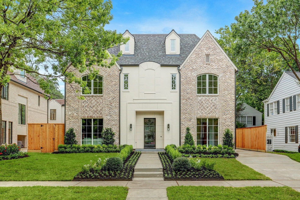 This exceptional English Traditional by Layne Kelly Homes is replete with designer finishes. The brand new build showcases a stately brick and stucco exterior with herringbone detail, accented by copper gutters. Inside, find a meticulously laid out three story floor plan.