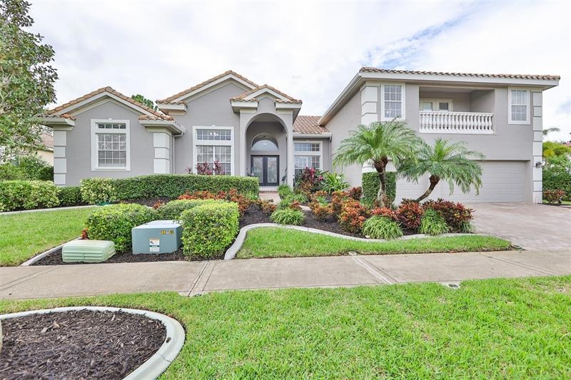 Front of home with gorgeous tropical  landscaping..