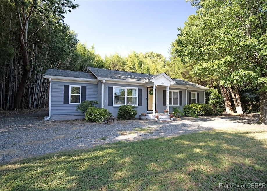 Single story home with a front lawn