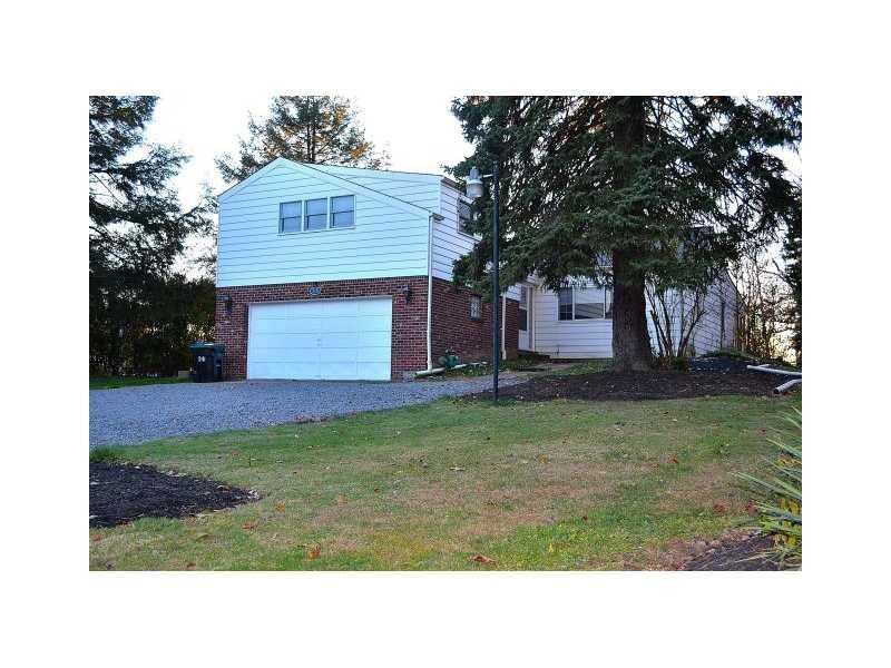 Exterior Front. The home has a brick and aluminum 