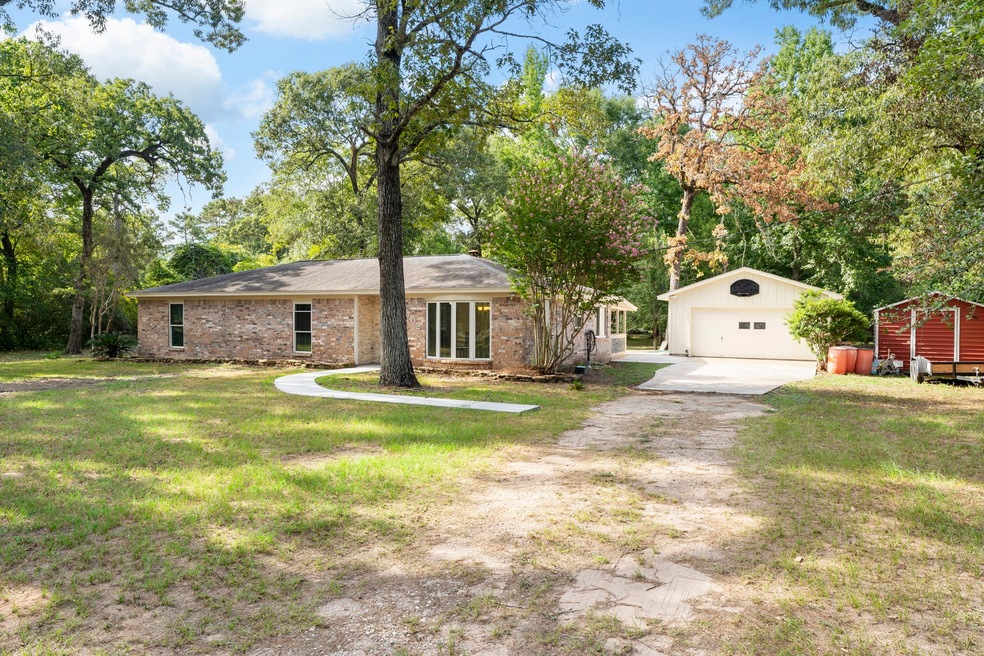 702 Sentinel Oaks, Pinehurst, TX 77362 - photo 1