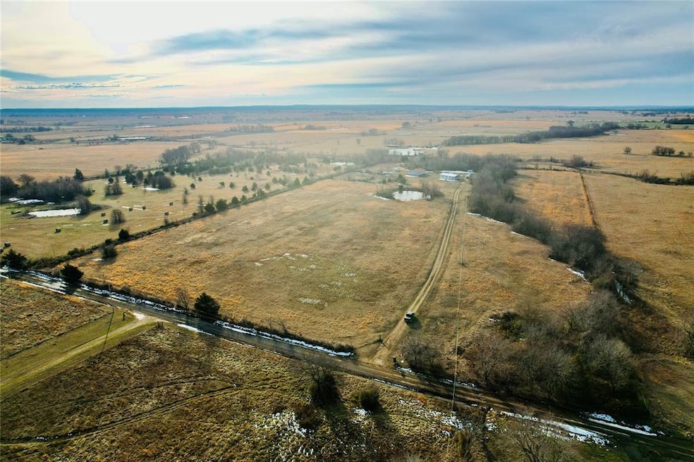 Birds eye view of property with a rural view