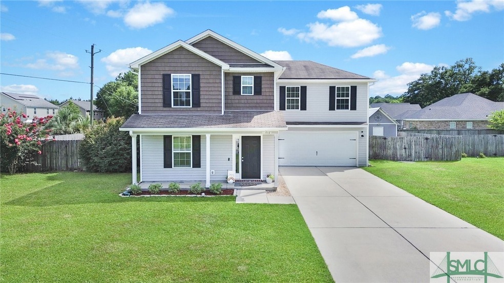 Sited on a .32 acre lot with fully fenced rear yar