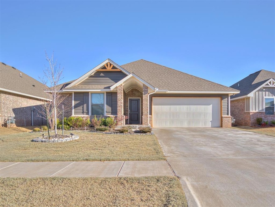 View of front of house featuring brick siding, dri