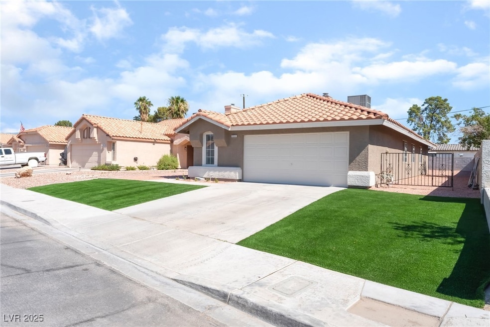 View of front of home with stucco siding, a tile r