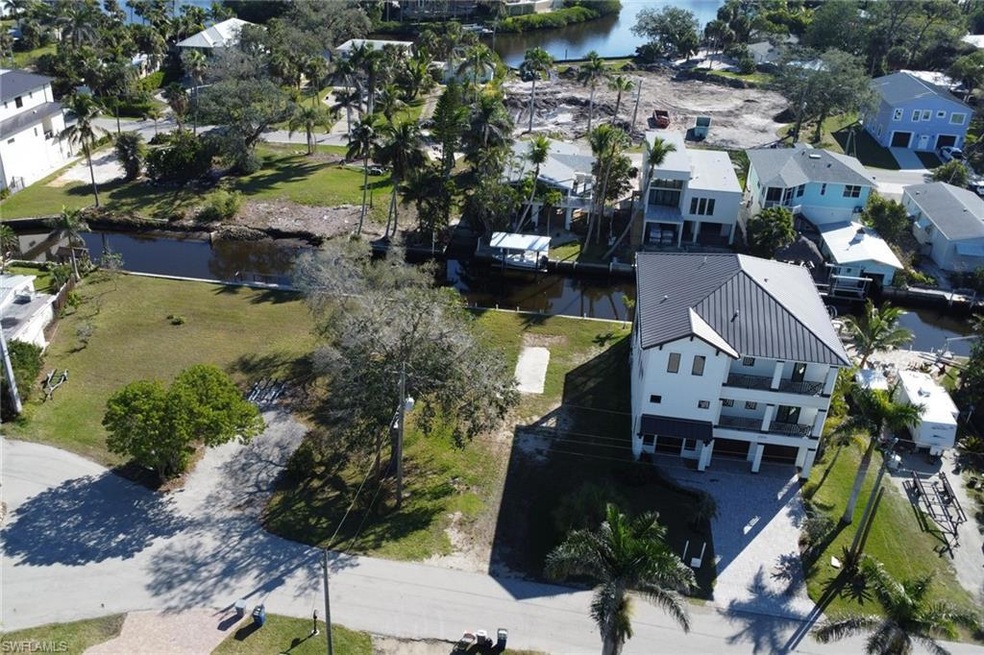 Bird's eye view featuring a water view and a resid