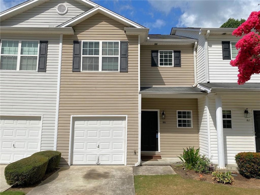 Townhome / multi-family property with a garage