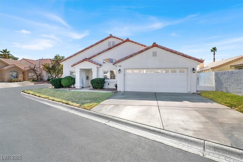 Mediterranean / spanish-style house with a garage,