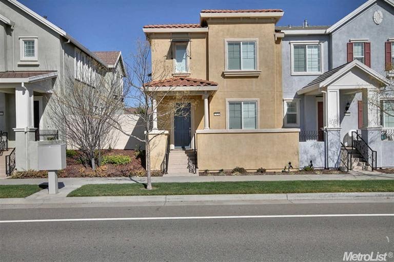 The home is at the end of the row of houses.