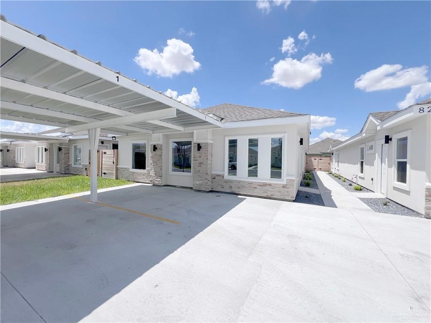 Rear view of house with covered parking