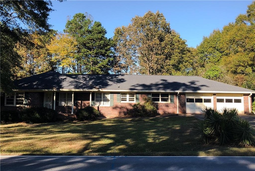 Sweet 4-sides brick ranch.