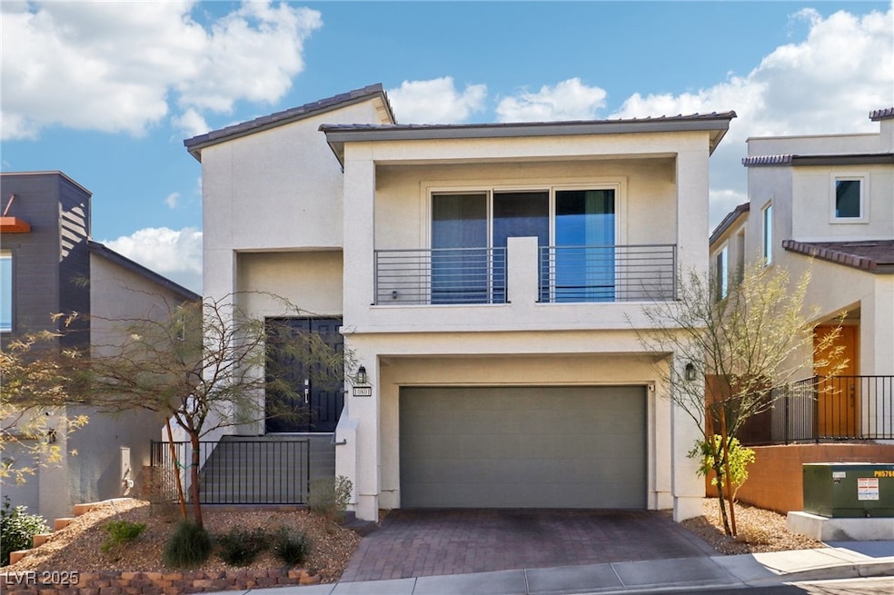 Contemporary house featuring a garage and a balcon