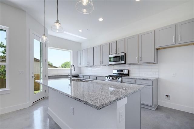 Bright and airy kitchen with large quartz counters