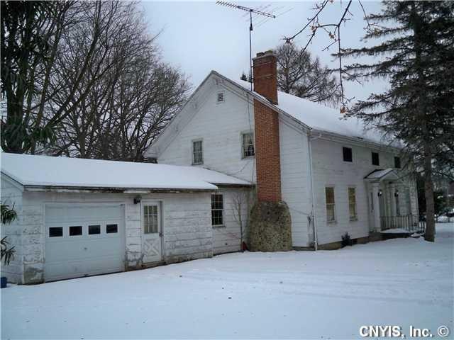Exterior Front. Large Elbridge Village home. Origi