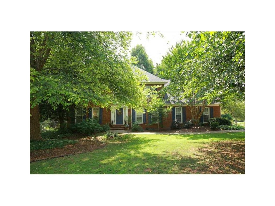 Exterior Front. Private setting on the corner of 2