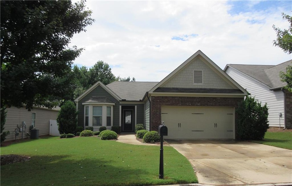 Beautifully maintained cement siding and stone ext