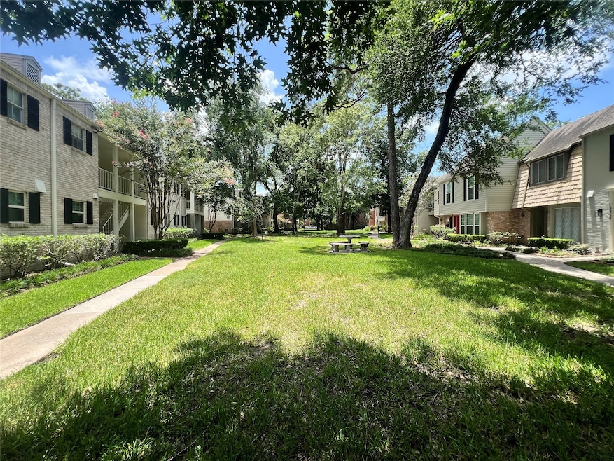 Immaculately kept neighborhood with lush greenery.