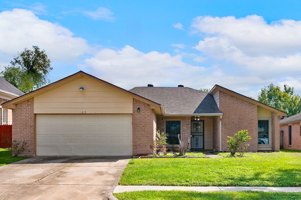 This is a single-story brick home featuring a two-
