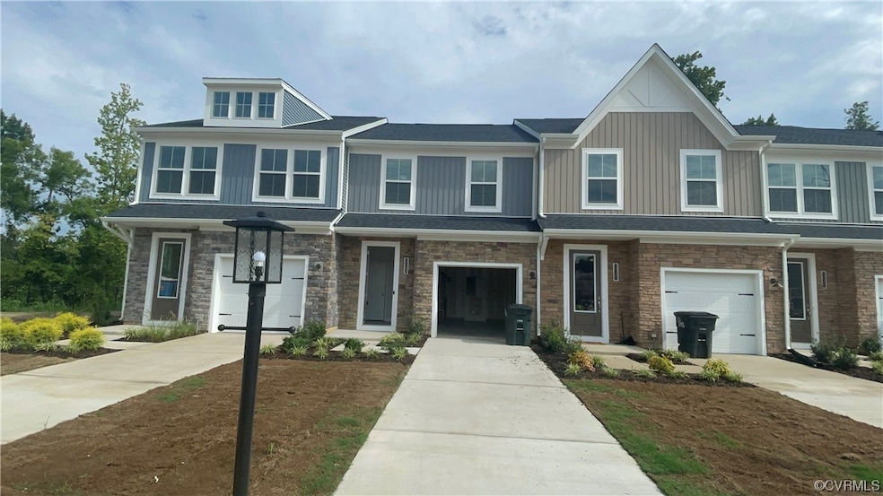 View of front facade featuring a garage