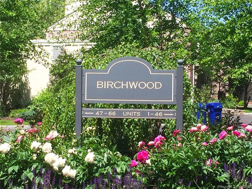 Entrance to Birchwood Condominiums in Spring