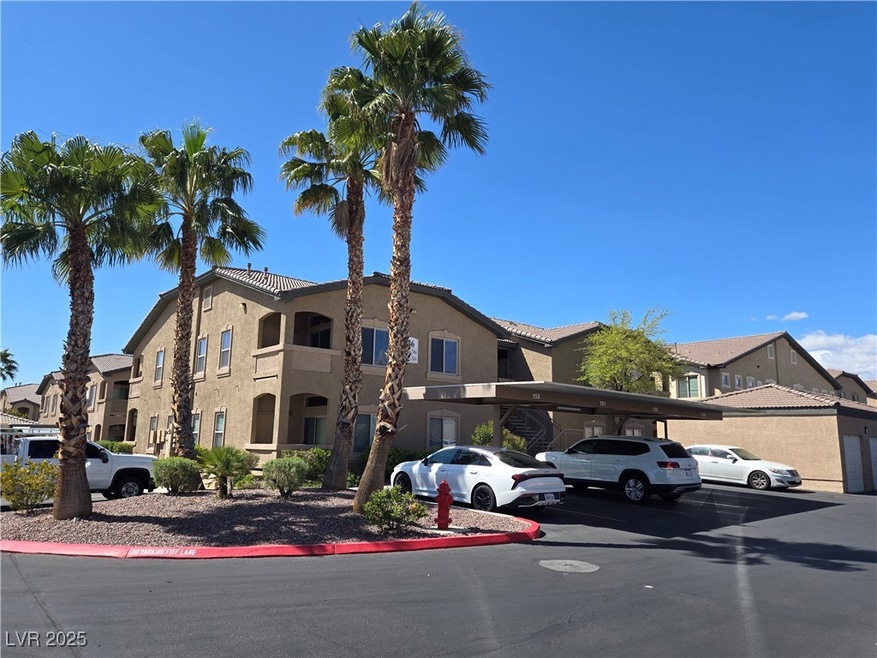 View of property with a residential view and cover