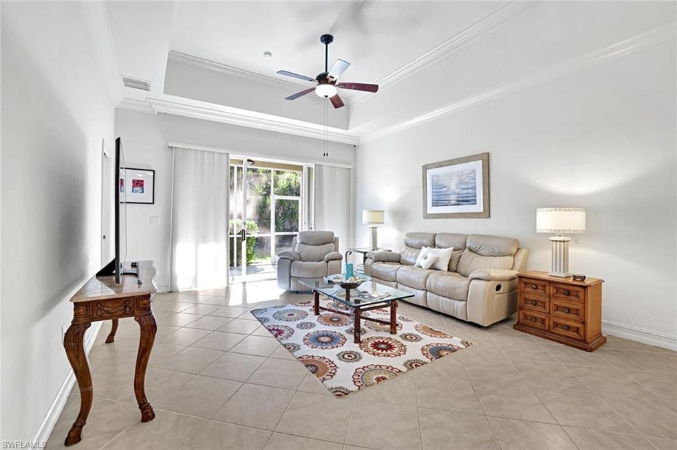 Open living area with tray ceiling