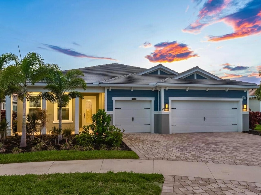 This near-new home with hurricane-impact doors, windows and sliders, whole house generator, two-year-old roof, porcelain tile throughout, outdoor ktichen, pool, and mere steps from the clubhouse and pool
