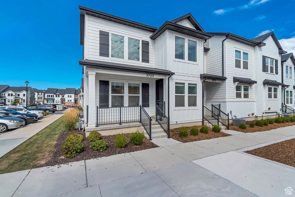 View of front of house featuring a residential view, a porch, and board and batten siding