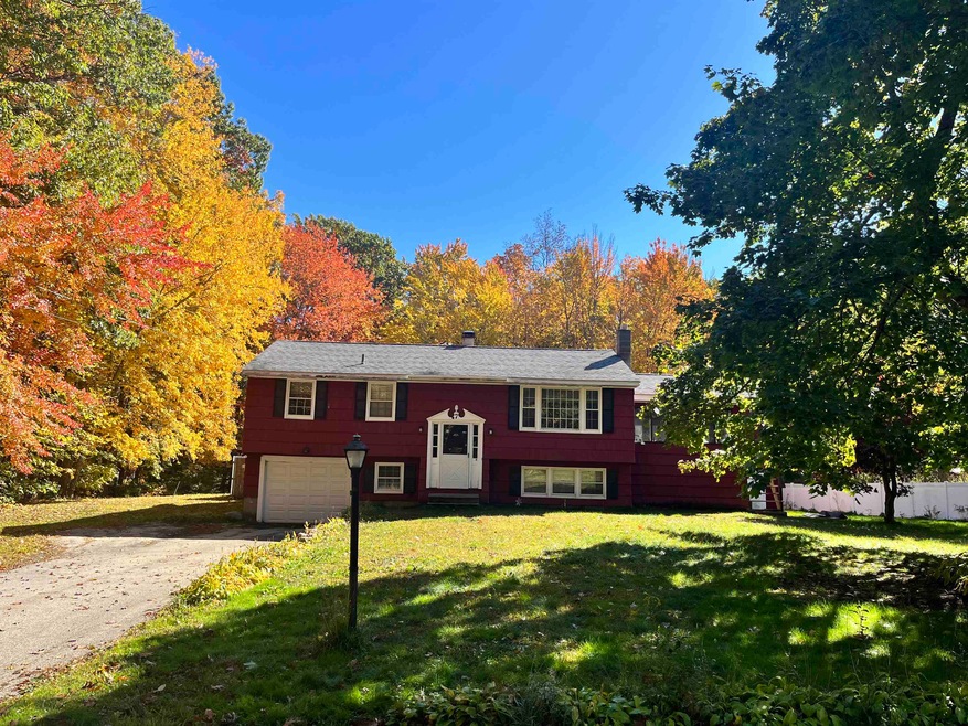 barn is to the right of the home