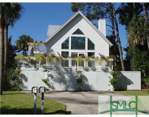 Exterior Front. Well manicured front lawn with spr