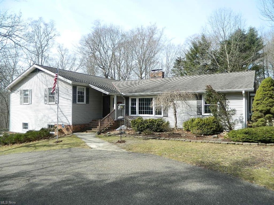 Welcome to 14040 Fox Hollow Drive, Novelty, Russell Township, OH  44072!  This Home Boasts 4/5 Bedrooms, 2-1/2 Baths, Living & Dining Rooms, Expansive Dine In Kitchen, Vaulted Great Room, 3 Season Sunroom, 5th BR or Office, Laundry Room with Nature S