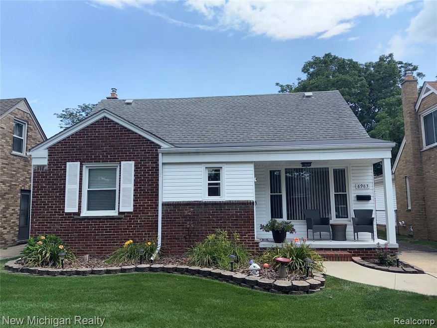 Bungalow with a porch, a front lawn, brick siding, and a shingled roof