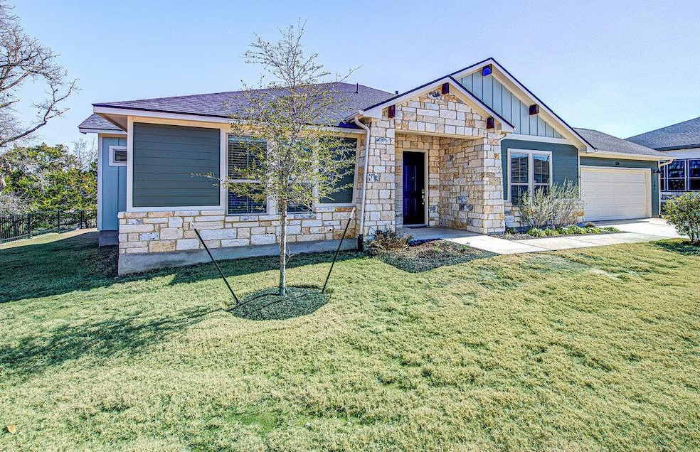 View of front of property with stone siding, an a