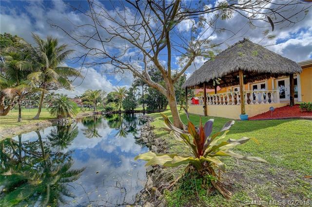 Breathtaking back yard featuring a private pond. T