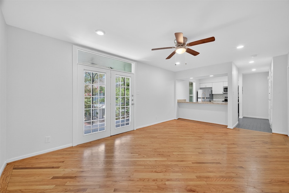 Bright and airy living space with hardwood floors,