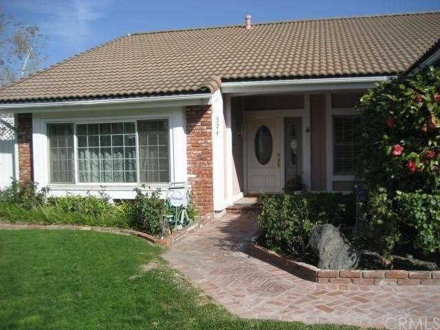 BRICK LINED WALKWAY TO LEADED GLASS FRONT DOOR